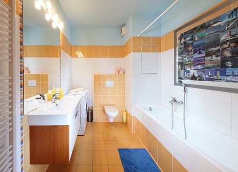 Bathroom in Apartment Vodni equipped with washing machine.